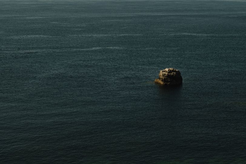 An emerging rock in the sea