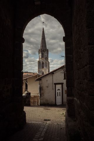 A church framed inside a arched passageway