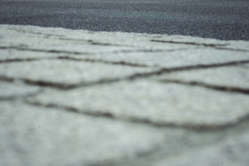 Blurry picture of the ground taken by a falling camera