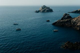 Three boats near shores