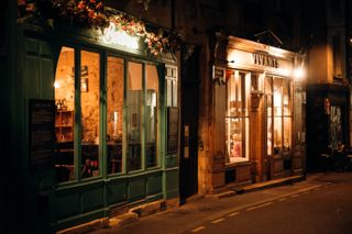 Cozy restaurants in an alley by night