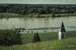 Landscape from a hill with an emerging top of a church