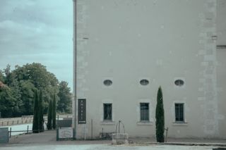 Big light building and its corner entrance