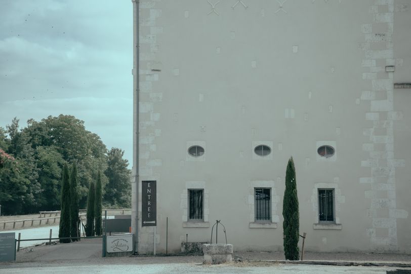 Big light building and its corner entrance