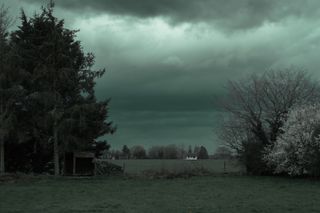 Rural landscape under an incoming storm