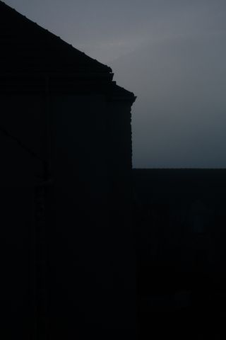 Silhouette of a house at dawn