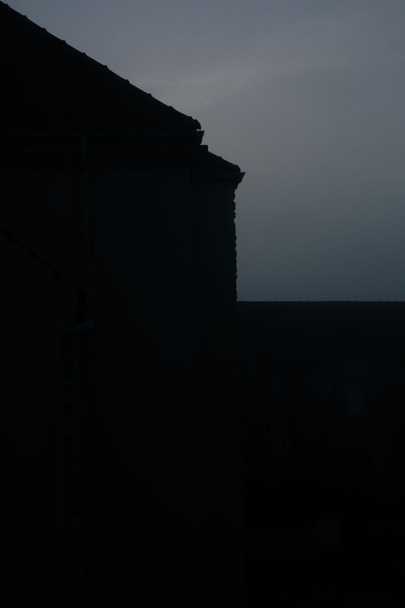 Silhouette of a house at dawn