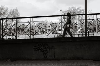 A woman walking on a descending sidewalk
