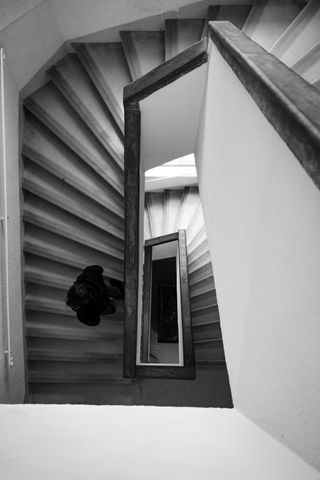 Staircase from above with someone in it