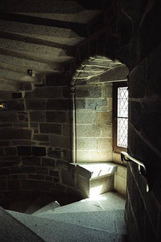 Medieval stairs enlightend by an old window