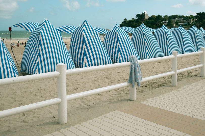 A child sweatshirt left on a fence on a the beach
