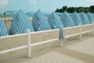 A child sweatshirt left on a fence on a the beach