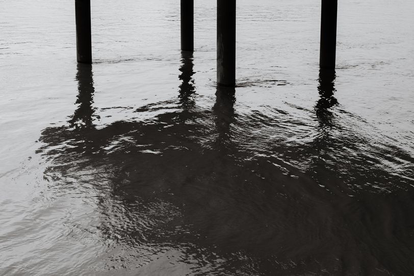 Foundation poles of a building over water