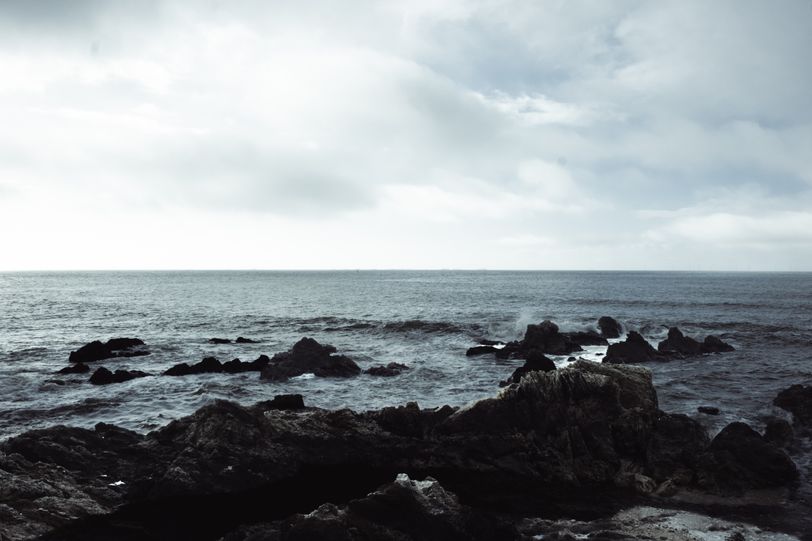 Rough shore with a calm sea
