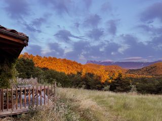 Sunset view from a cabin on a hill