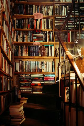 A library staircase filled with books