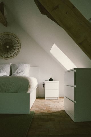 Cozy bedroom enlighten by the window