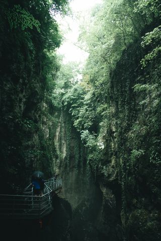 Catwalk going through the darkness of the Gorges du Fier