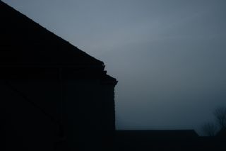 View on houses on a misty morning