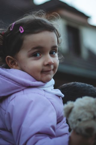 Portrait of a young lady on her father shoulders