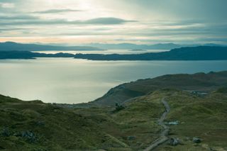 Landscape of scottish lochs on a rising sun