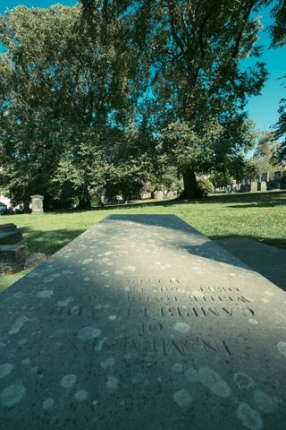 View of a cemetery from a tombstone on a sunny day