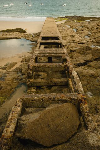 An old decaying hulk on a beach