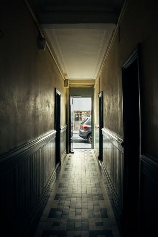Dark small hallway going towards the light