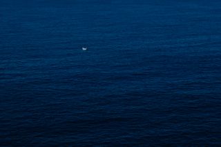 A small lonely boat in the sea
