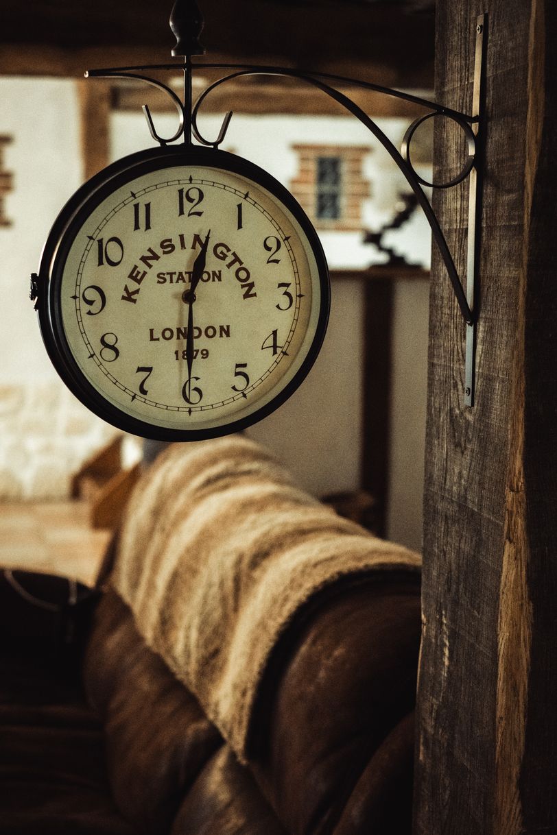 A wall-attached clock in a living room