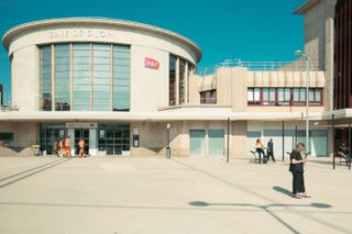 Front of a train station with multiple architectural shapes