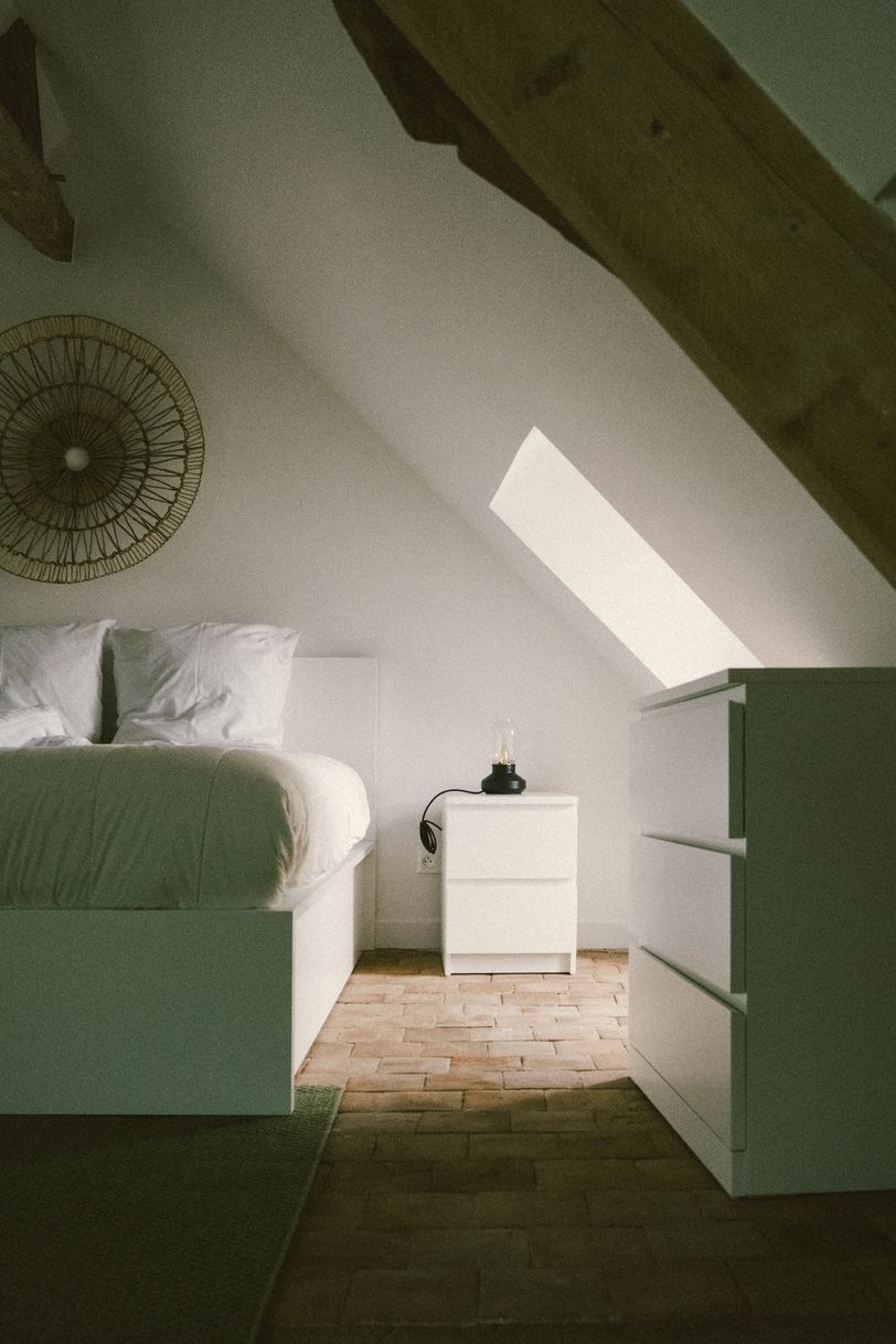 Cozy bedroom enlighten by the window