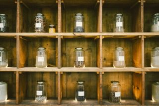 Shelf of different spices in jars