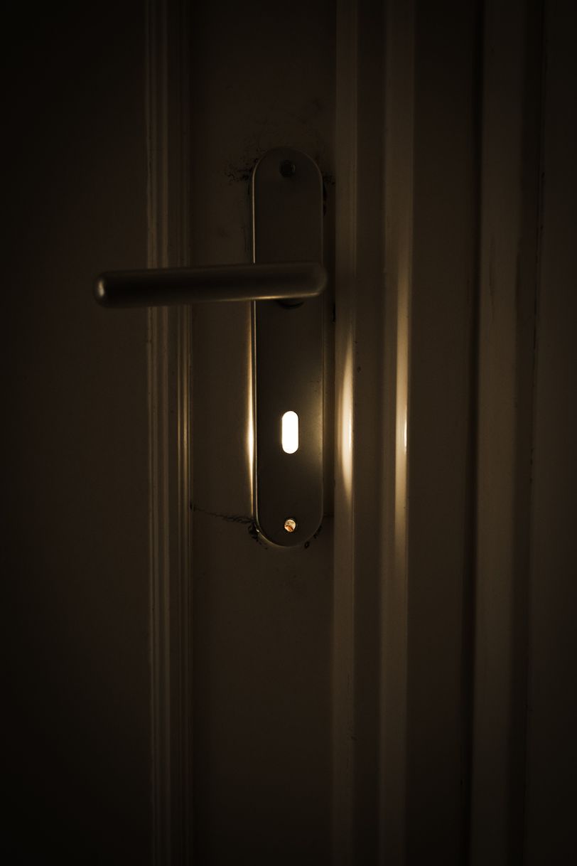 Sunlight coming out of a door's keyhole