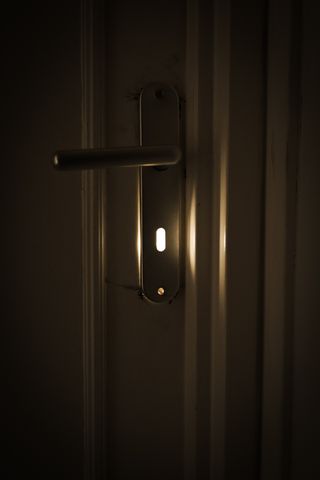 Sunlight coming out of a door's keyhole