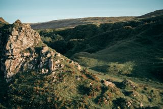 Landscape of rocky hill on sunset