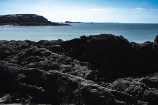 Rocky shores before a peaceful sea