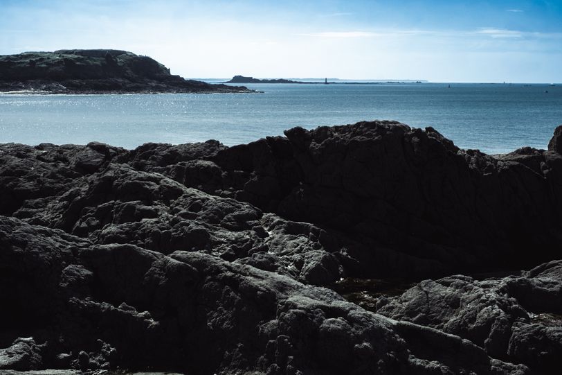 Rocky shores before a peaceful sea