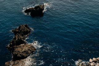 Rocks emerging from a calm sea