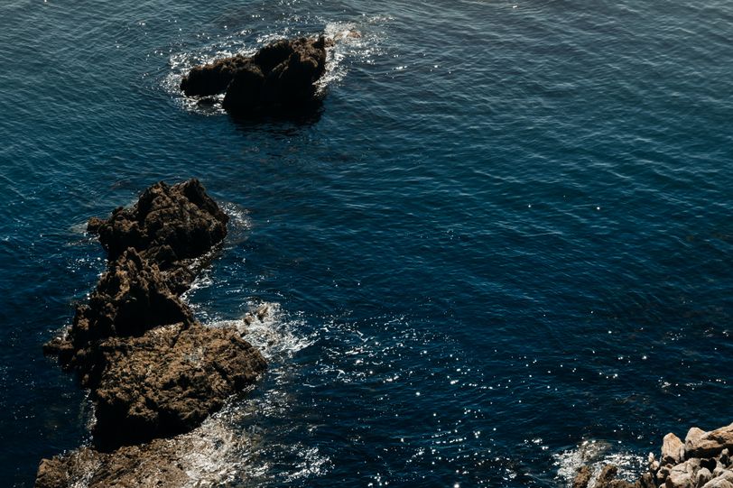 Rocks emerging from a calm sea