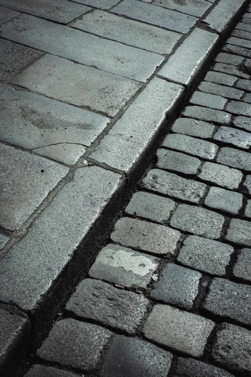 Gutter of a paved road and sidewalk