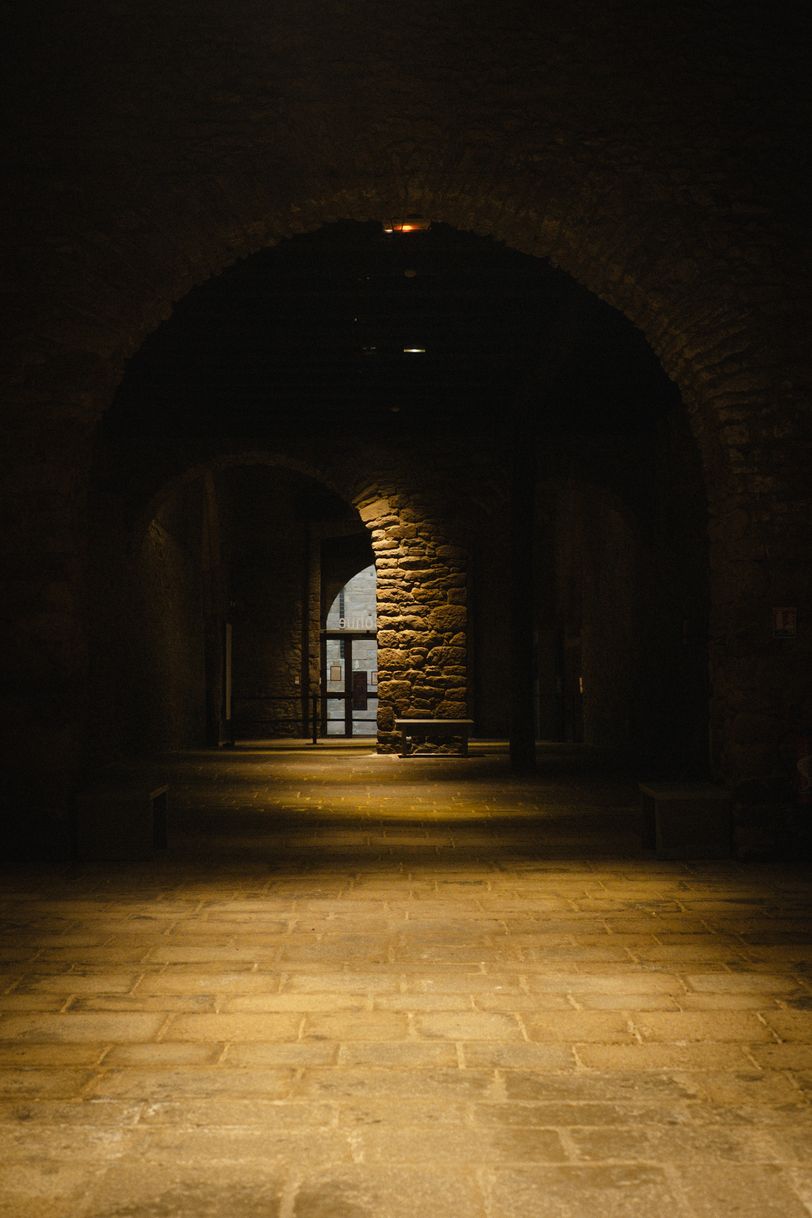 Long, empty and barely enlighten hallway