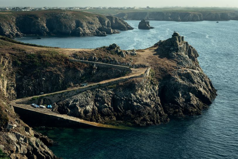 Shores with a zigzag road from the hill to the sea